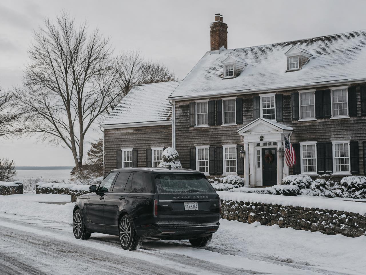 Dark SUV outside a snowy Long Island home